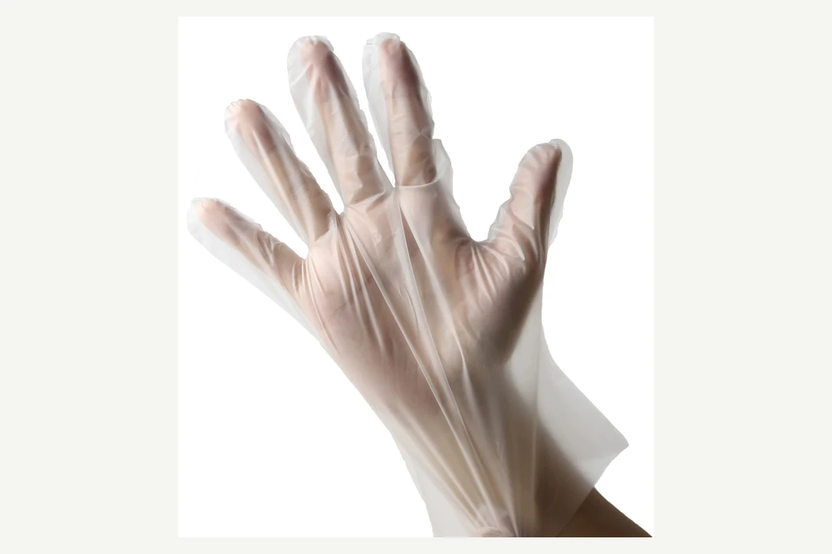 Clear film gloves worn on overlapping hands with loose finger folds