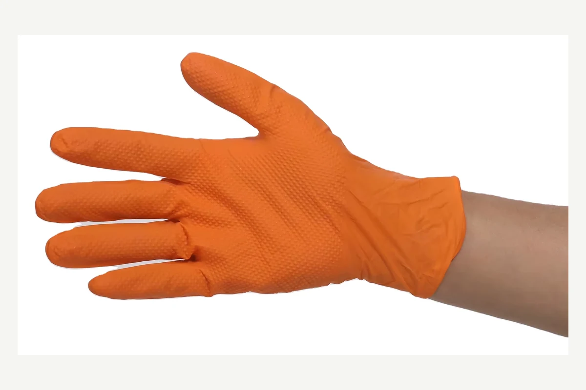 Orange disposable glove showing an open palm and a rolled cuff