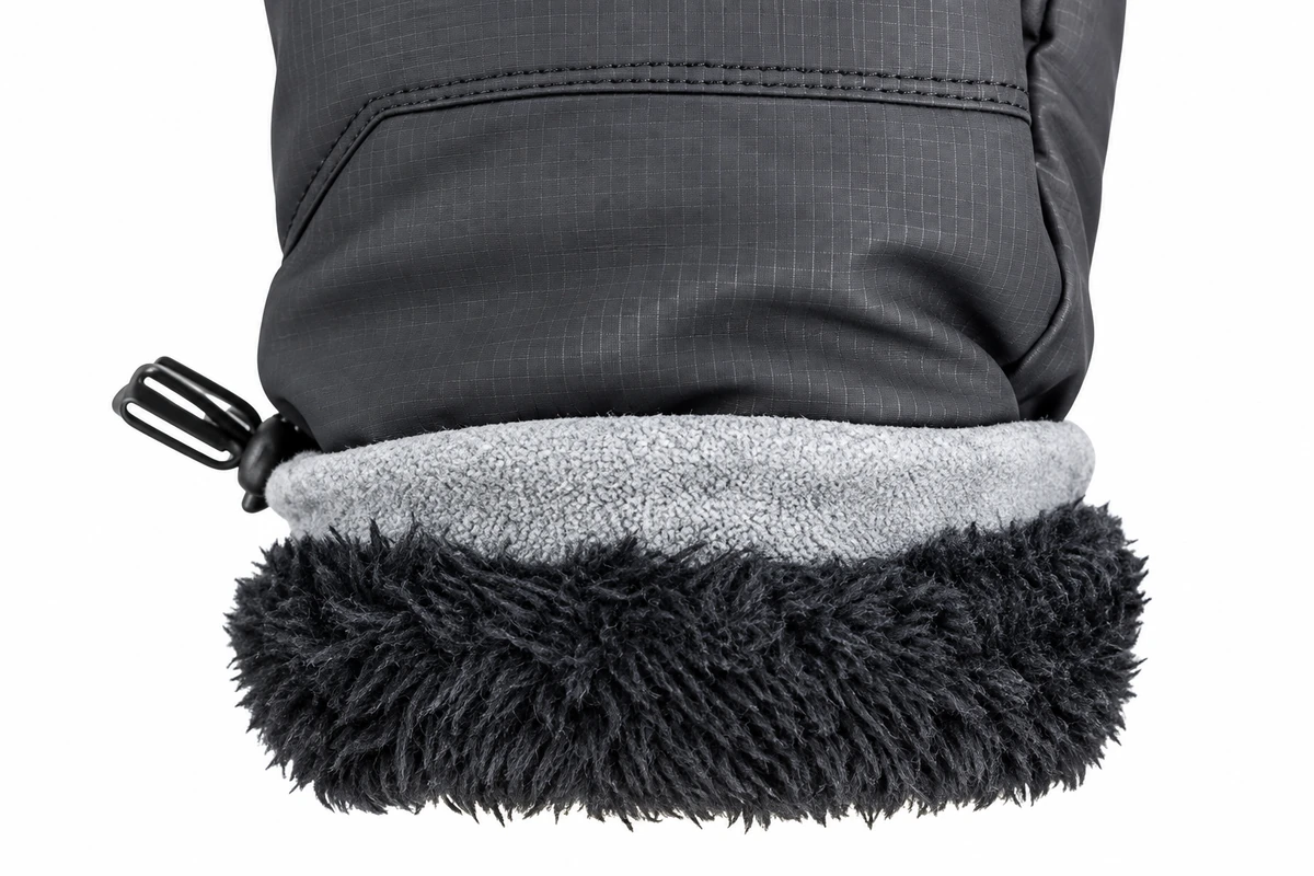 Turned glove cuff showing gray and black lining beside the outer shell