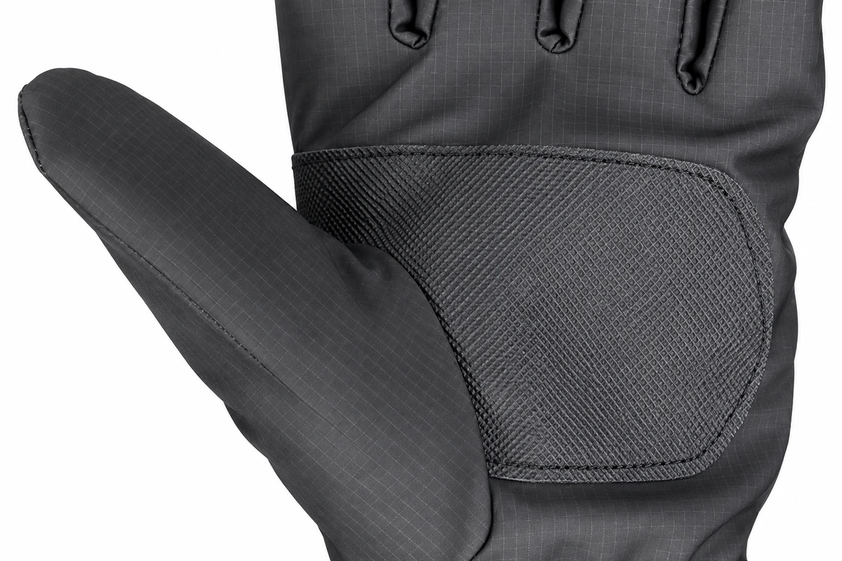 Stitching around a textured palm panel on a gray winter glove