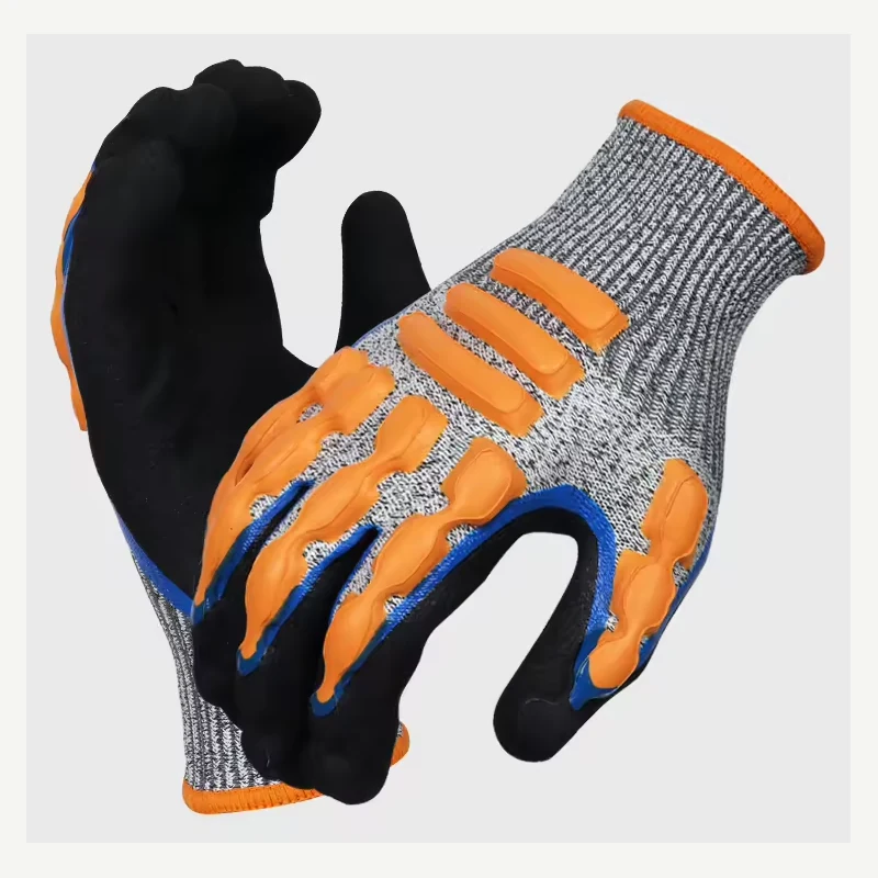 Gray knit work gloves with black palms and raised orange back guards