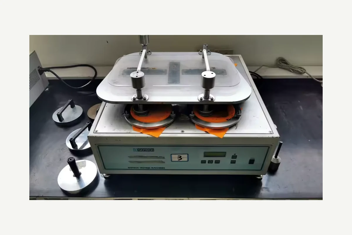 Laboratory material testing machine with circular sample holders