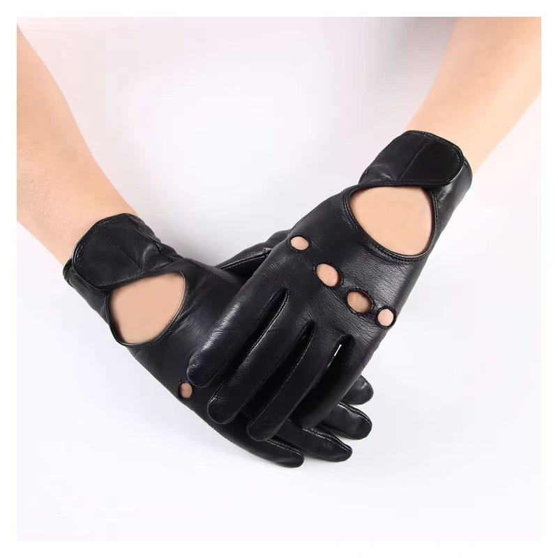 Black leather driving gloves worn with open knuckles and wrist fasteners