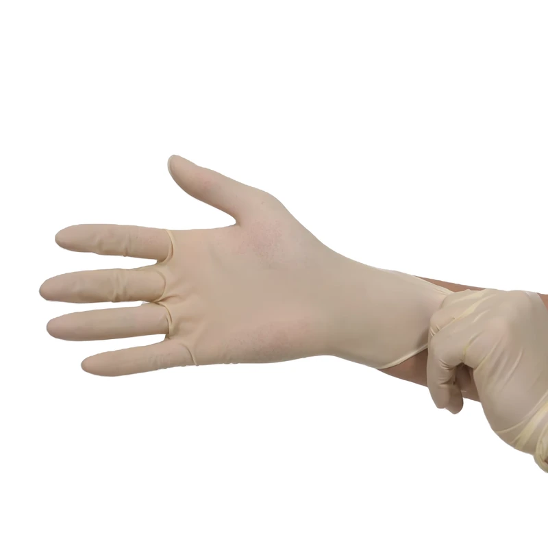 Cream disposable glove with an open palm and cuff being adjusted
